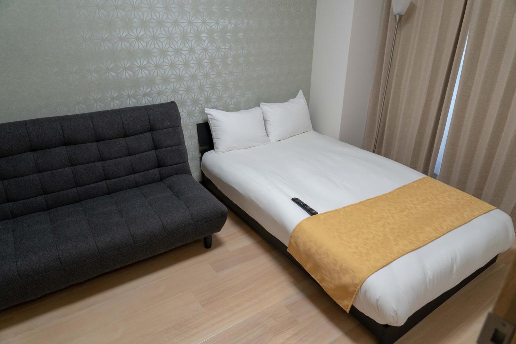 大阪ルミエール夕陽丘 Apartamento Exterior foto